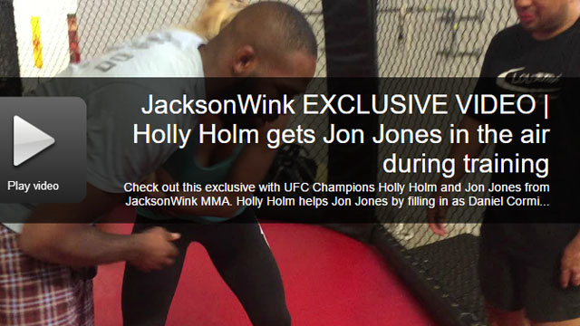 Holly Holm gets Jon Jones up way off his feet while grappling