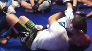 Wanderlei Silva spars and grapples with a little kid