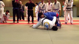 Joao Miyao as a purple belt rolling with a black belt