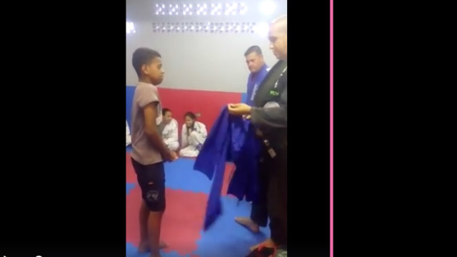 Poor Kid Cries As His Instructor Gives Him His First Gi