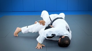 Attacks from the half-guard: A sweep with arm control